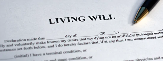 Physical copy of a living will that has blank spaces for someone to fill in information and put their initials