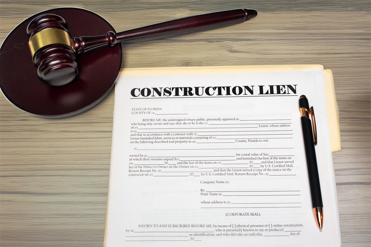 Blank copy of a Florida construction lien form used by lawyers. The form is on a desk next to a pen and gavel