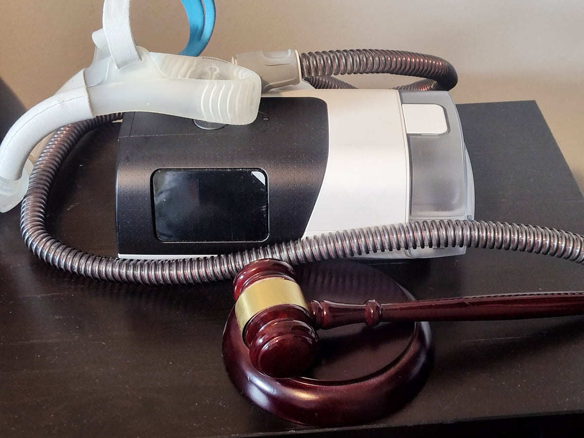 CPAP machine with a gavel symbolizing legal action and Medicare fraud enforcement